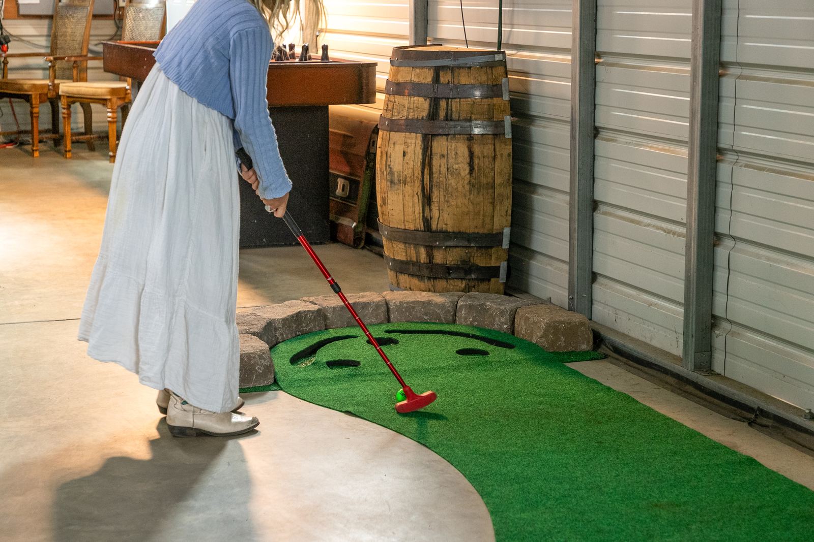 Putting on the green built into the barn floor.